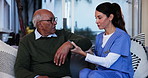 Arm, assisted living or rehabilitation with nurse and old man on sofa in home for consulting or recovery. Checkup, consulting or mobility with woman and senior patient in apartment for physiotherapy