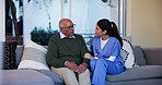 Nurse, support and uneasy with old man on sofa in living room for Alzheimer, behavior symptoms and helping others. Healthcare, medical and senior care with people in retirement home for sympathy