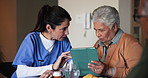 Tablet, discussion and nurse with senior woman in assisted living facility for healthcare checkup. Technology, talking and caregiver with elderly patient for diabetes consultation in nursing home.