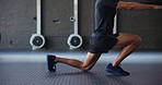 Man, lunge and exercise in gym for fitness, health and muscle growth with body weight or challenge. Athlete, workout and training legs for sports performance, development and balance with stretching