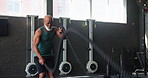 Fitness, rope and strength with mature black man in gym for physical workout or strength training. Exercise, energy and performance with athlete person in health club for challenge or improvement