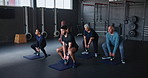 Gym, senior people and trainer with kettlebell in class for training, muscle workout or mobility support. Man, equipment and exercise with squat in fitness lesson for balance, strength or body health