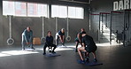 Coach, group and kettlebell in gym with people, fitness and muscle development at class in retirement. Person, elderly men and women with weightlifting for workout, training and exercise at club