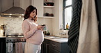 Pregnant woman, phone and texting for baby advice in home for online shopping or research. Drinking coffee, pregnancy and mom with tea on social media for maternity info, chat and prenatal health