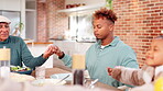 Praying, family and healthy diet, breakfast and smile for feast in dining room, dad and daughter. House, senior man and son with religion, thanksgiving and gratitude for food, holding hands and salad