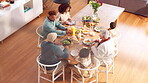 Family, above and eating of dinner, home and bonding with children in thanksgiving, juice and salad. Dining table, top view and healthy food for grandparents, kids and celebration of Christmas