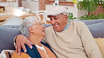 Senior couple, laugh and hug on sofa for love, support and commitment together in marriage with smile. Elderly people, embrace and happy in house for bonding, relax and relationship with connection