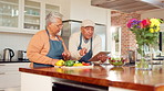 Tablet, cooking and senior couple in kitchen together with healthy food, relationship and elderly in retirement. Help, old man and woman in home with bonding, support or love with meal prep for lunch