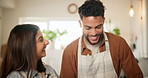 Couple, cooking and happy with conversation in kitchen, laugh and teaching with smile, nutrition and dinner. Man, woman and support with advice, ingredients or food with talking for meal prep in home