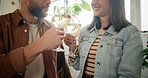 Wine, happy couple and cheers in kitchen for date, dinner or lunch in home together. Smile, man and woman drinking alcohol beverage for toast, drink or bonding for afternoon meal or anniversary