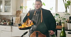 Man, flambe and kitchen as chef for nutrition, diet or hospitality in home with frying pan. Male person, culinary art for gourmet cuisine, cooking or technique for meal preparation, dinner and food
