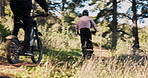 Ebike, speed and sustainability with friends in forest for path, travel and relax. Peace, environment and cycling with people ride on dirt trail for challenge, carbon footprint and transportation