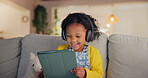 Girl, child and tablet for audio in home, online education and listening to podcast for learning. Female person, kid and playing games in living room for mind development, happy song and streaming