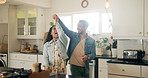 People, couple and happy with dancing in kitchen for anniversary celebration, bonding and fun. Family, relationship and smile or laughing as newlyweds at home for care, support and trust with music