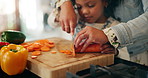 Hands, child and mother cutting vegetables for food, learning or cooking healthy lunch in home kitchen. Kid, parent and chopping board with knife closeup for carrots, organic meal and teaching girl