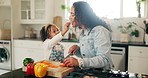 Mother, girl and happy with cooking in kitchen at home for bonding, teaching and support. Parent, kid and smile or excited on preparing dinner with ingredients or vegetable for child development