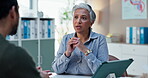 Woman, doctor and consultation with GP at clinic for medical evaluation, information and advice. Healthcare, discussion and man with mature worker at desk for assessment, support and treatment plan