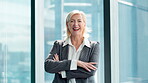 Business woman, face and mature in corporate office as confident with arms crossed as investment banker. Female person, smile and portrait in financial agency for equity on stocks and finance in USA