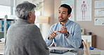 Man, doctor and consultation with GP at clinic for medical evaluation, information and support. Appointment, discussion and woman with healthcare worker at desk for treatment plan, review and advice