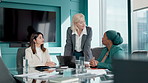 Business women, laptop and proposal for partnership, meeting or project management in office. Professional, people and talk with discussion, communication and planning for recruitment at workplace