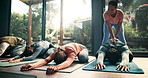 Yoga, instructor and class with stretching in studio for flexibility, holistic wellness and body balance on floor. Group, people and pilates with technique for fitness, mindfulness and spiritual zen