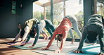 Pilates, exercise and class with stretching in studio for flexibility, holistic wellness and body balance on floor. Group, people and yoga with technique for glutes, mindfulness and spiritual zen