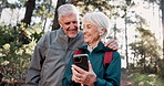 Phone, hiking or senior couple laughing in nature for connection, social media or streaming in forest. Norway, smile or happy people trekking in woods for funny meme comedy, travel and mobile app