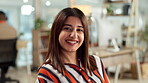 Face, design and smile with creative woman at desk in workplace for professional web development. Business, portrait and website with confident graphic designer laughing in agency office for research