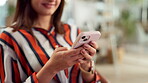 Hands, phone and smile with business woman in creative workplace for communication or design. App, networking and social media with happy web development employee in office for internet research