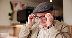 Senior, man and relax with glasses in cafe for eyesight problem, vision correction and glaucoma prescription lens. Elderly, person and wear reading spectacles in restaurant for eye care and eyewear
