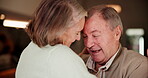 Elderly couple, smile and dance with love in home for marriage, care and bonding in retirement. Senior woman, man and happiness with hug in house for commitment, connection and romance on anniversary