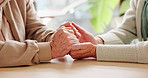 Holding hands, care and senior couple by table for support, empathy or comfort for aging. Unity, home and elderly man and woman with connection for trust, commitment and love in marriage bonding.