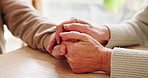 Holding hands, connection and senior couple by table for love, empathy or forgiveness in marriage. Unity, home and elderly man and woman with support for trust, loyalty and care for bonding together.