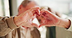 Senior couple, heart hands and sign with love for romance, care or support together at home. Closeup, elderly man and woman or lovers with shape, symbol or review for romantic gesture or relationship