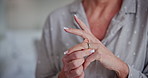 Elderly woman, hands and ring with memory for commitment, marriage or symbol of love at home. Closeup, senior or female person playing with jewelry or diamond on finger for engagement or promise