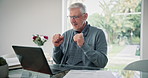 Fist pump, happy and mature man on laptop in home for retirement bonus, payment and investment. Success, finance and senior person on computer for loan application, winning and savings in living room