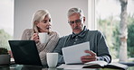 Finance, documents and mature couple on laptop in home for budget, financial review and mortgage payment. Retirement, paperwork and man and woman on computer for online banking, bills and insurance