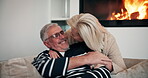 Love, hug and smile with old couple on sofa for romance, retirement and marriage milestone. Happiness, calm and commitment with senior man and woman in living room of home for peace and trust