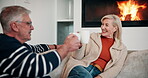 Sofa, senior couple and cheers with coffee for funny memory, nostalgic stories and connection at home. Happy, man and woman with tea for drinking, conversation and bonding with beverage in marriage