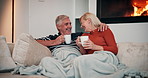 Sofa, senior couple and conversation with laugh for funny memory, nostalgic stories and connection at home. Happy people, man and woman with coffee for bonding, joke or healthy marriage in retirement