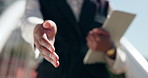 Business person, handshake and tablet with greeting for welcome, introduction or deal in city. Closeup, employee or salesperson shaking hands for legal agreement, partnership or b2b in an urban town