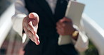 Business person, handshake and tablet with deal for agreement, introduction or greeting in city. Closeup, employee or salesperson shaking hands for legal partnership, welcome or b2b in an urban town