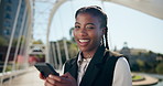 Wink, phone and face of black woman in city for business, typing and real estate agent at office park. Smile, businesswoman or realtor with smartphone, search and confidence in urban development