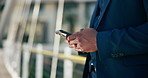 Phone, city and hands of business person for communication, typing message and b2b networking. Professional, corporate and worker on smartphone for internet, website and social media in urban town