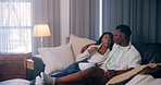 Home, relax and black couple on sofa, entertainment and watching tv in living room. African man, woman and rest on couch, comfortable and hobby with movie, film and series with fun and relationship