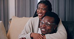 Black couple, hug and popcorn for watching tv on sofa with movie, film or streaming show at home. Relax, television and people in living room with cinema snack, subscription service and weekend relax