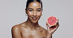 Skincare, fruit and woman in studio, face and smile for benefits, beauty or confident with product. Spa, white background and portrait of girl with cosmetics, smooth or shine of skin with dermatology