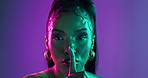 Face, girl and beauty with secret on neon background for glamour makeup, aesthetic gossip and drama news. Portrait, woman and privacy sign for cosmetic announcement, surprise emoji and lighting glow