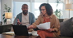 Couple, bills and laptop with tax stress and discussion of mortgage and debt paperwork with fight. Anxiety, document and invoice of banking, finance risk and accounting problem of loan in home