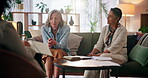 Mature women, friends and holding hands with psychologist for counseling, support and guidance. People, care and sad with conversation on therapy for stress management, mental health and advice